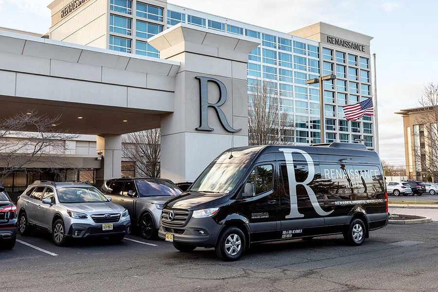 shuttle van parked outside hotel