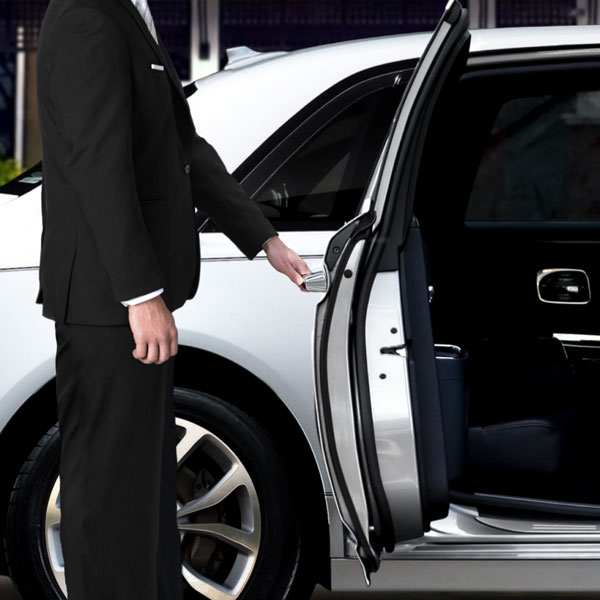 valet opening door of luxury car
