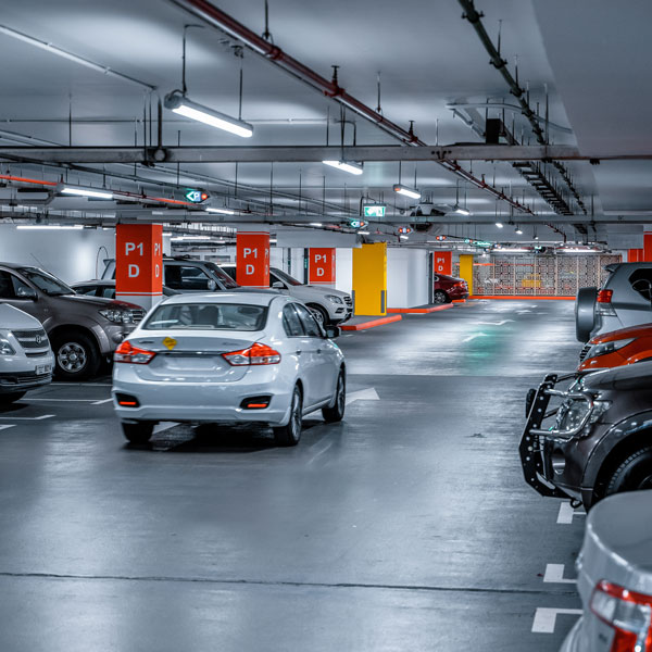 car driving through parking garage